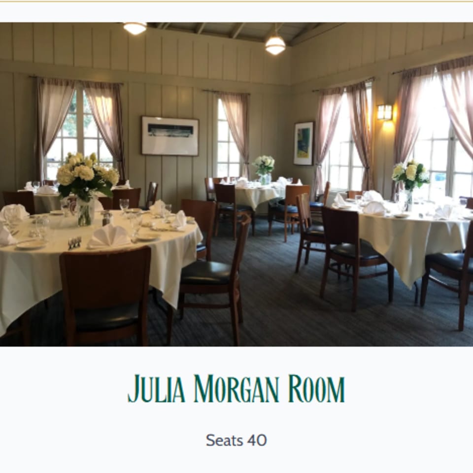 The Julia Morgan Room, a private dining area with set tables, white tablecloths, and floral centerpieces.